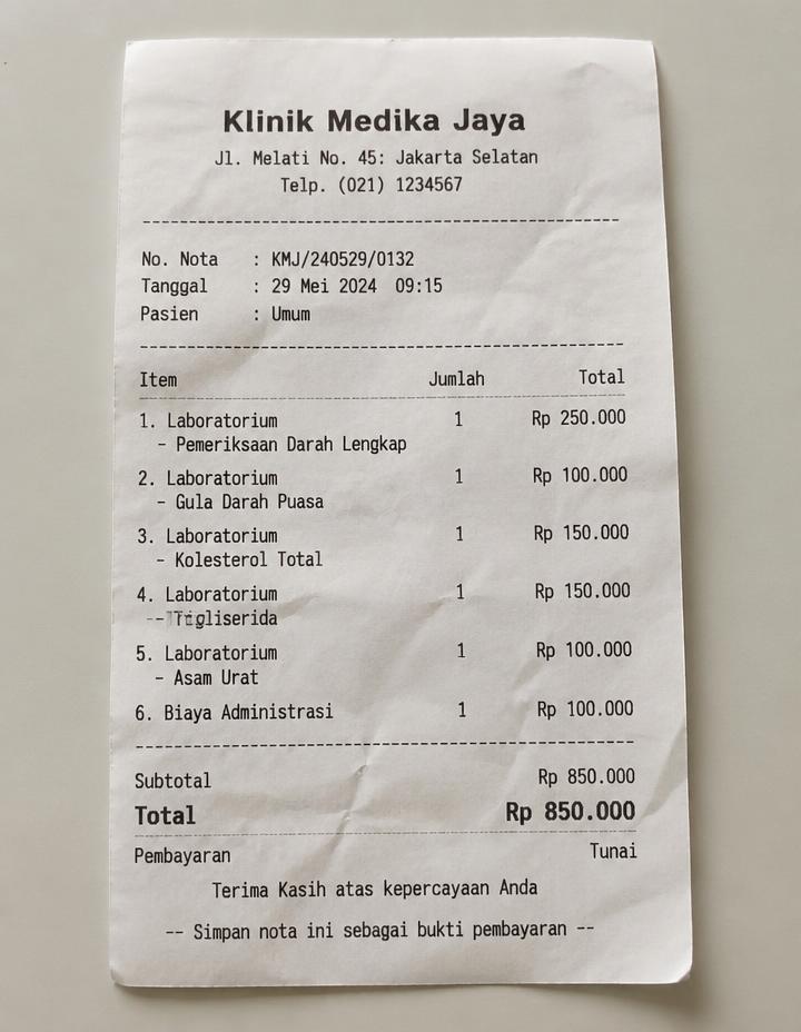 Photo of a crumpled Klinik Medika Jaya receipt